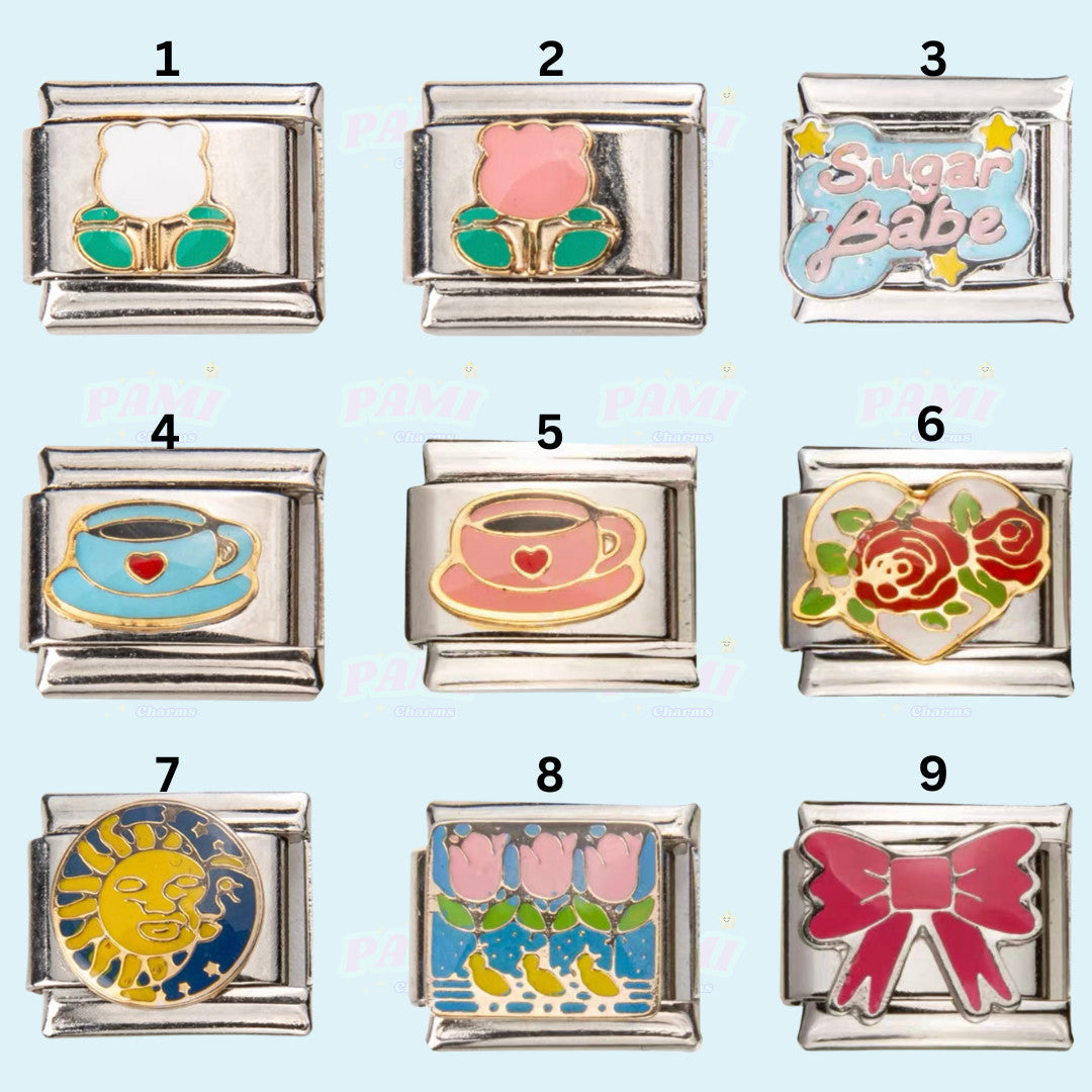 Set of nine Pami Charms italian charms including flowers, teacups, Sugar Babe text, rose heart, sun, tulips, and pink bow designs