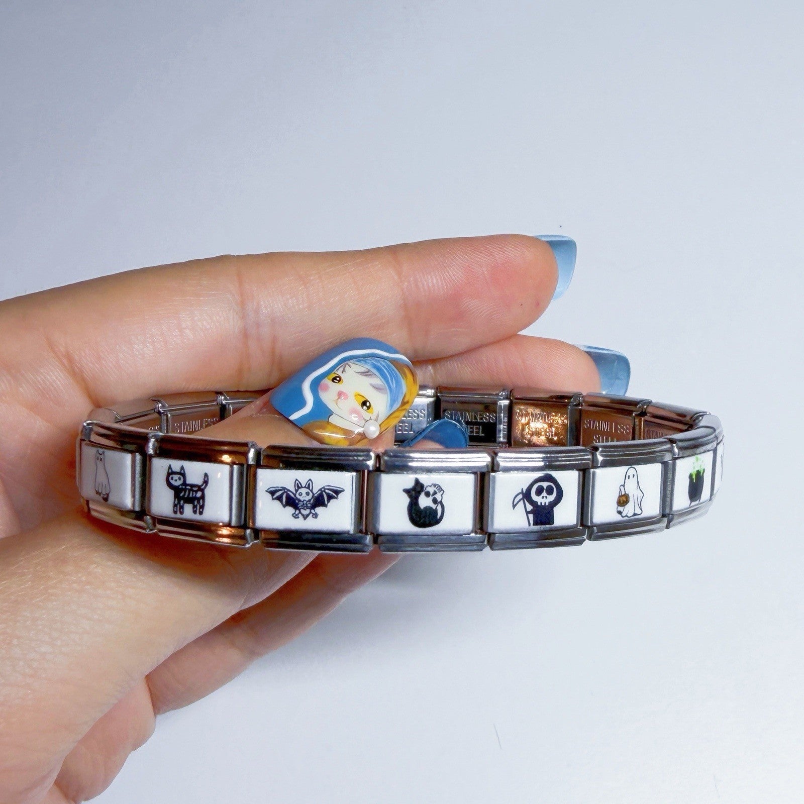 Pami Charms Italian charm bracelet featuring unique designs like cats, bats, and skulls