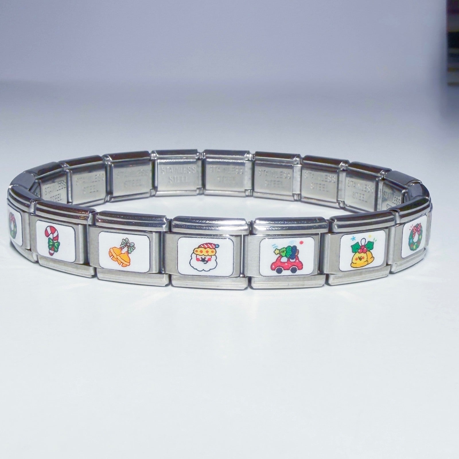 Pami Charms Italian charm bracelet featuring colourful festive designs and durable stainless steel links