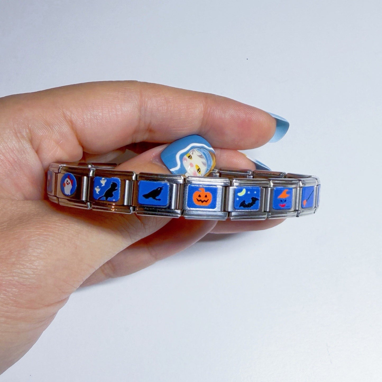 Pami Charms Italian charm bracelet featuring Halloween designs like ghosts and pumpkins