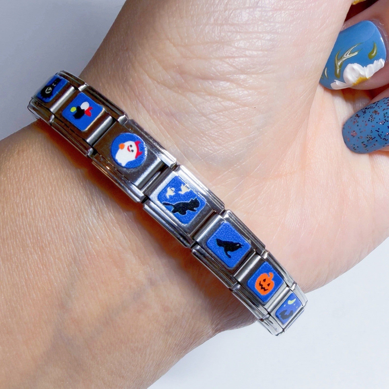 Pami Charms Italian charm bracelet featuring colourful designs and a stylish silver finish