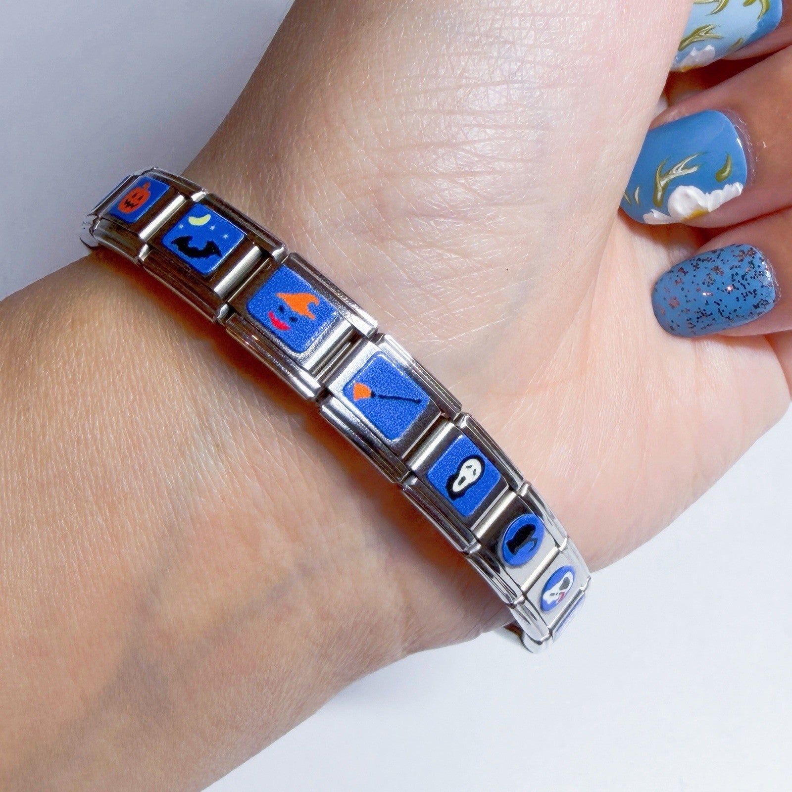 Pami Charms Italian charm bracelet featuring colourful designs in blue tones