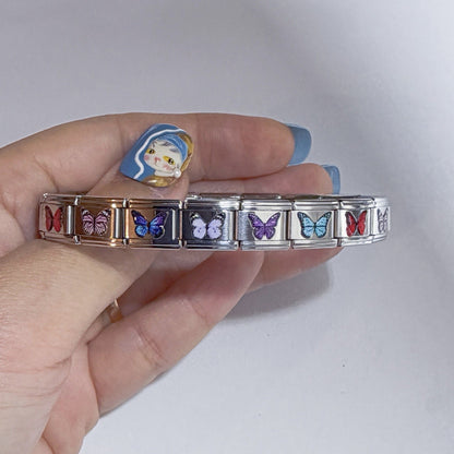 Pami Charms Italian charm bracelet featuring colourful butterfly designs on stainless steel links