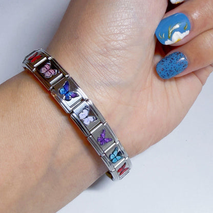 Pami Charms Italian charm bracelet featuring colourful butterfly designs on a silver band