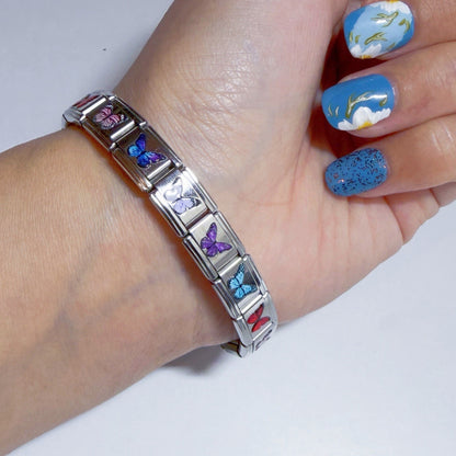 Pami Charms Italian charm bracelet featuring colourful butterfly designs on a silver chain