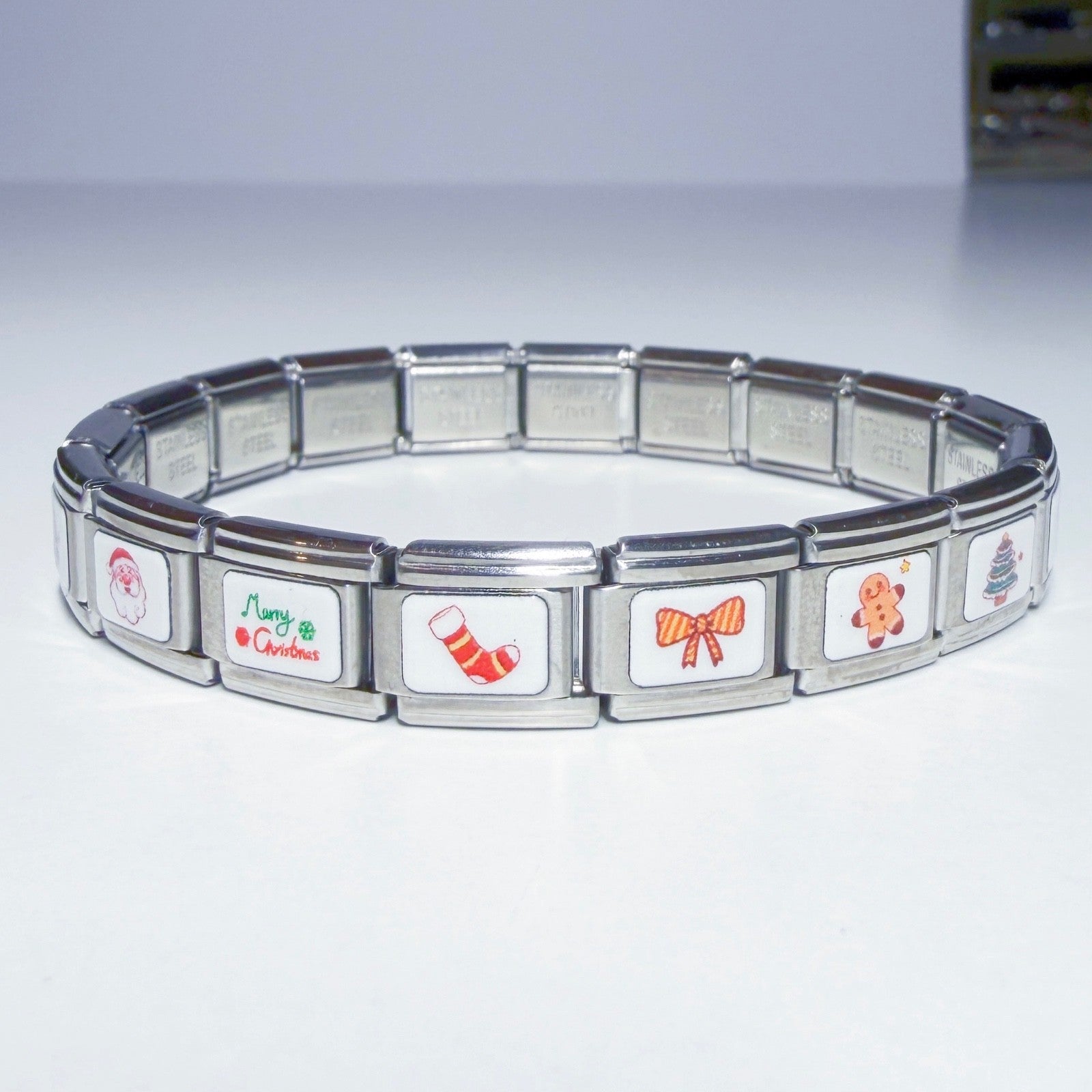 Pami Charms Italian charm bracelet featuring festive holiday designs like Christmas stockings and gingerbread