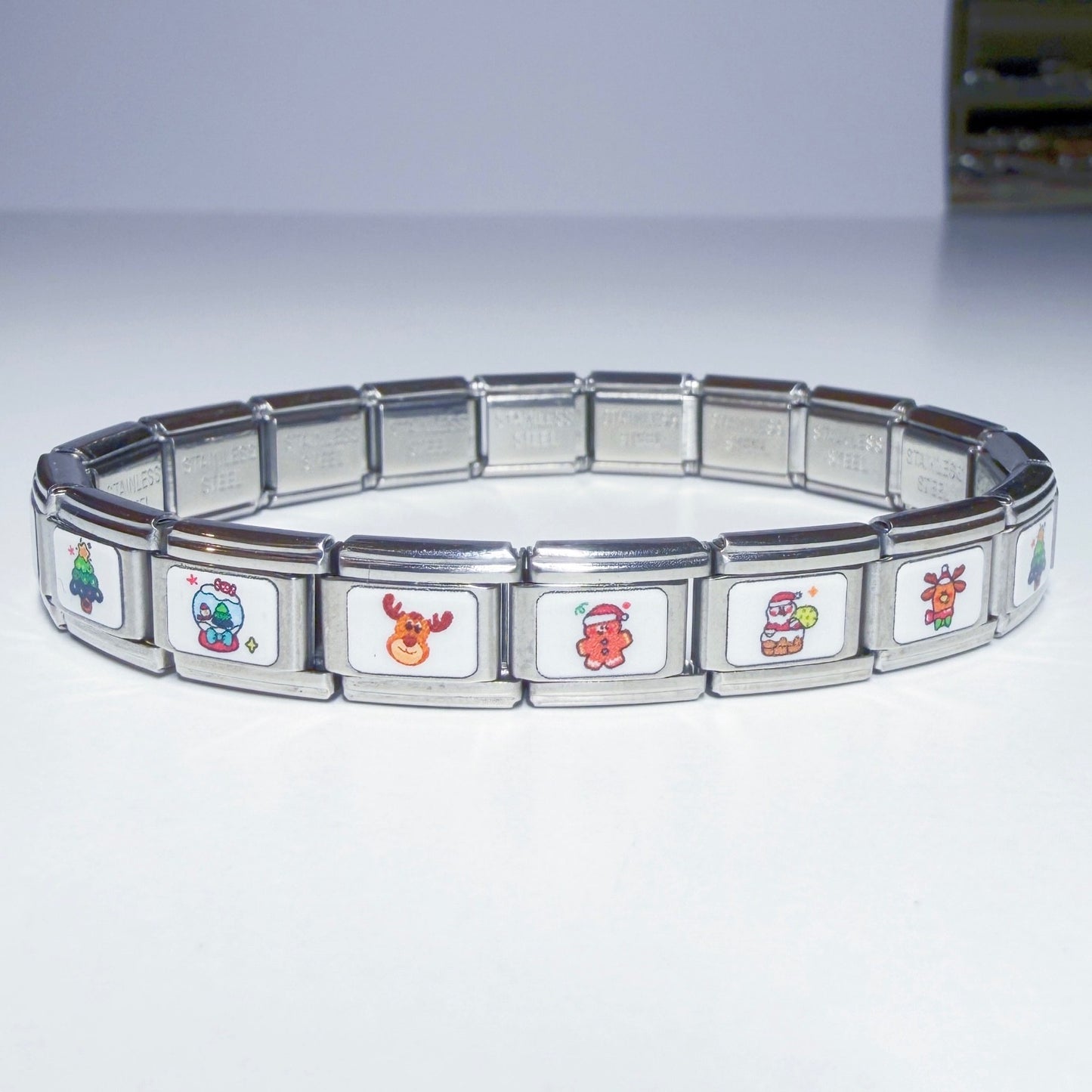 Pami Charms Italian charm bracelet featuring festive designs like Santa and reindeer