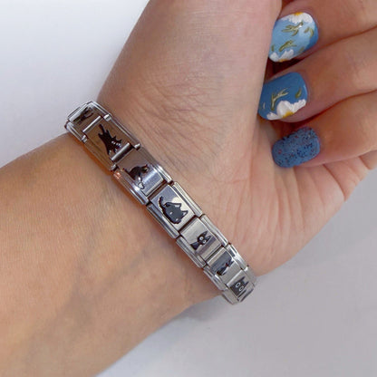 Silver Pami Charms bracelet with various designs, featuring unique italian charm links