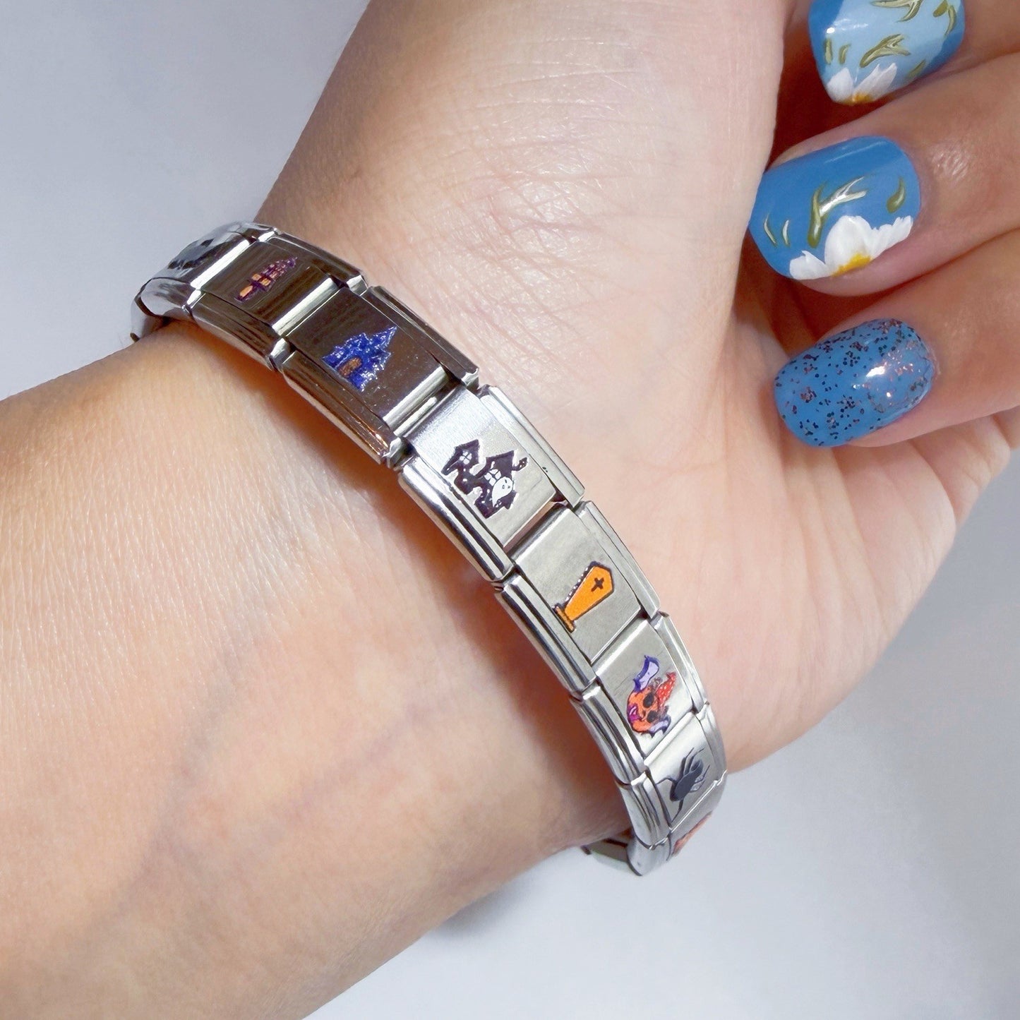 Pami Charms Italian charm bracelet featuring colourful designs on a stainless steel band