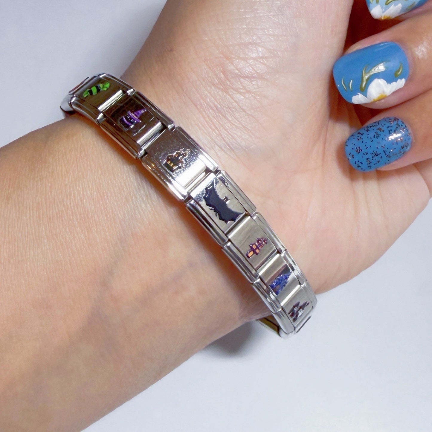 Stylish Pami Charms Italian charm bracelet featuring colourful enamel designs on a silver band