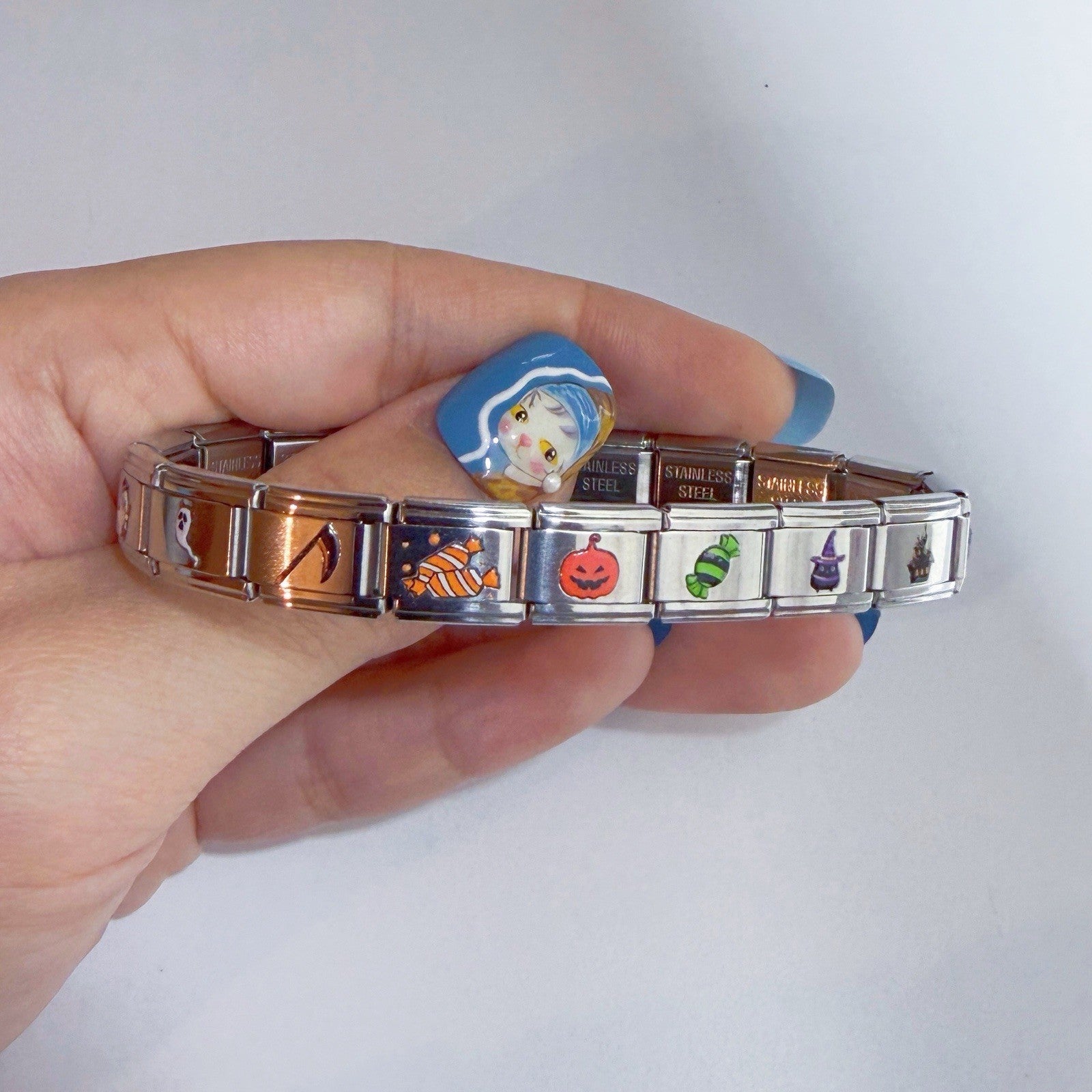 Collection of Pami Charms Italian charm bracelet featuring colourful seasonal designs and stainless steel links