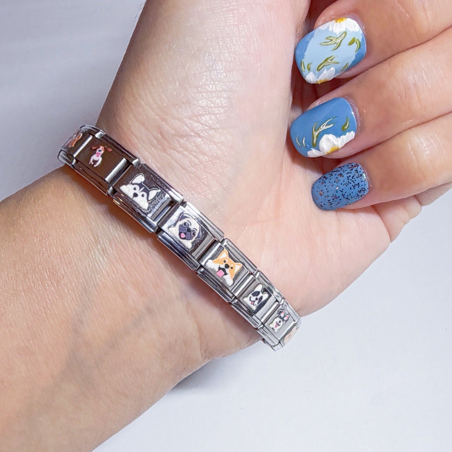 Pami Charms Italian charm bracelet featuring vibrant animal designs on a silver link band
