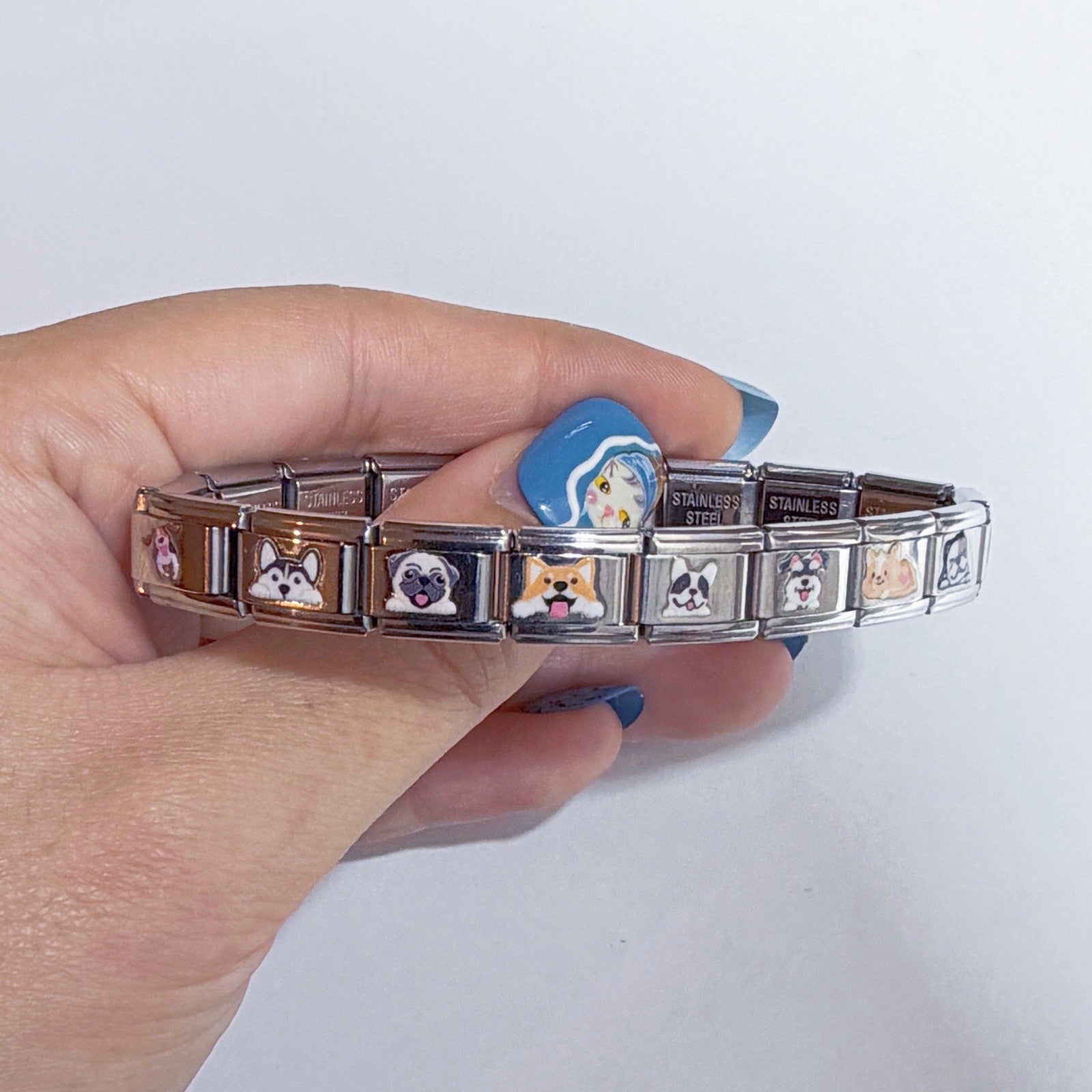 Pami Charms Italian charm bracelet featuring various charming designs and stainless steel links