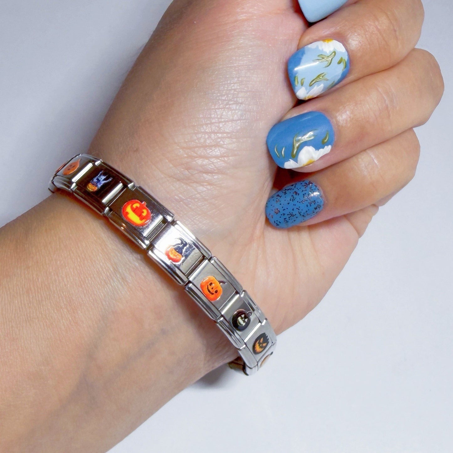 Stylish silver bracelet featuring colourful Italian charms for a personalised look