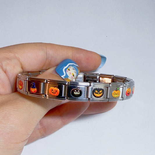 Pami Charms Italian charms bracelet featuring Halloween designs like pumpkins and witches