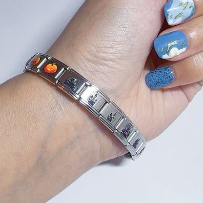 Stylish silver bracelet adorned with vibrant Italian charms featuring various designs