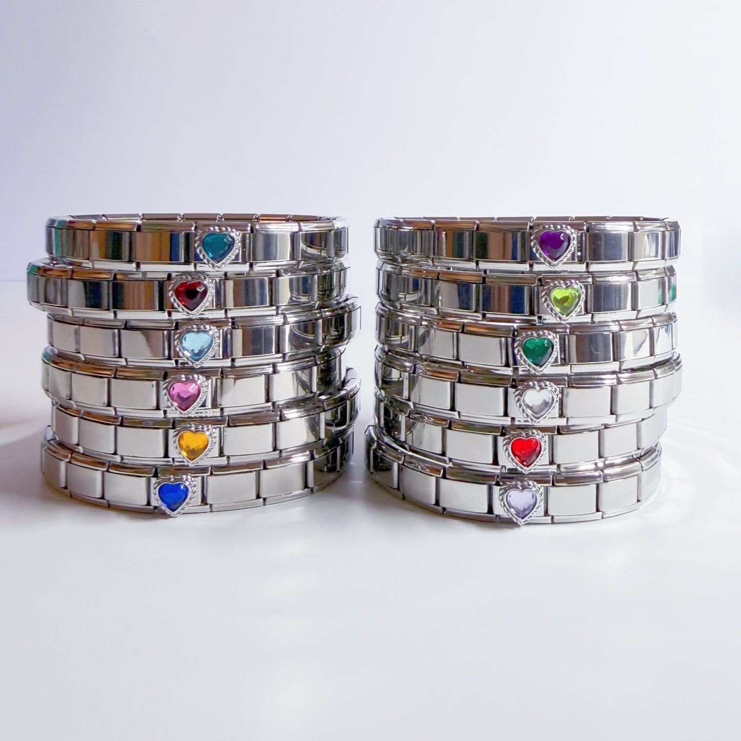 Pami Charms Italian charm bracelets featuring colourful heart-shaped stones in a sleek silver design