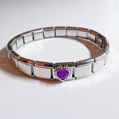 Pami Charms Italian charm bracelet featuring a purple heart charm and a sleek silver design