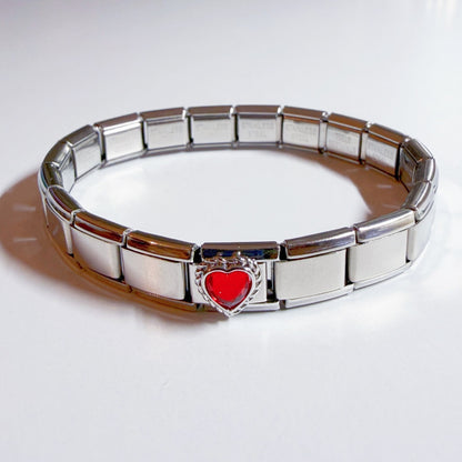 Pami Charms Italian charm bracelet with a silver band and a heart-shaped red charm