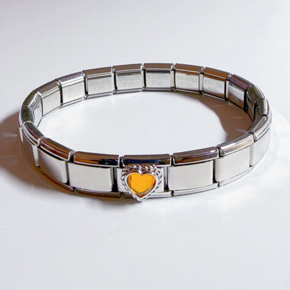 Silver Italian charm bracelet featuring a yellow heart charm for a stylish accessory