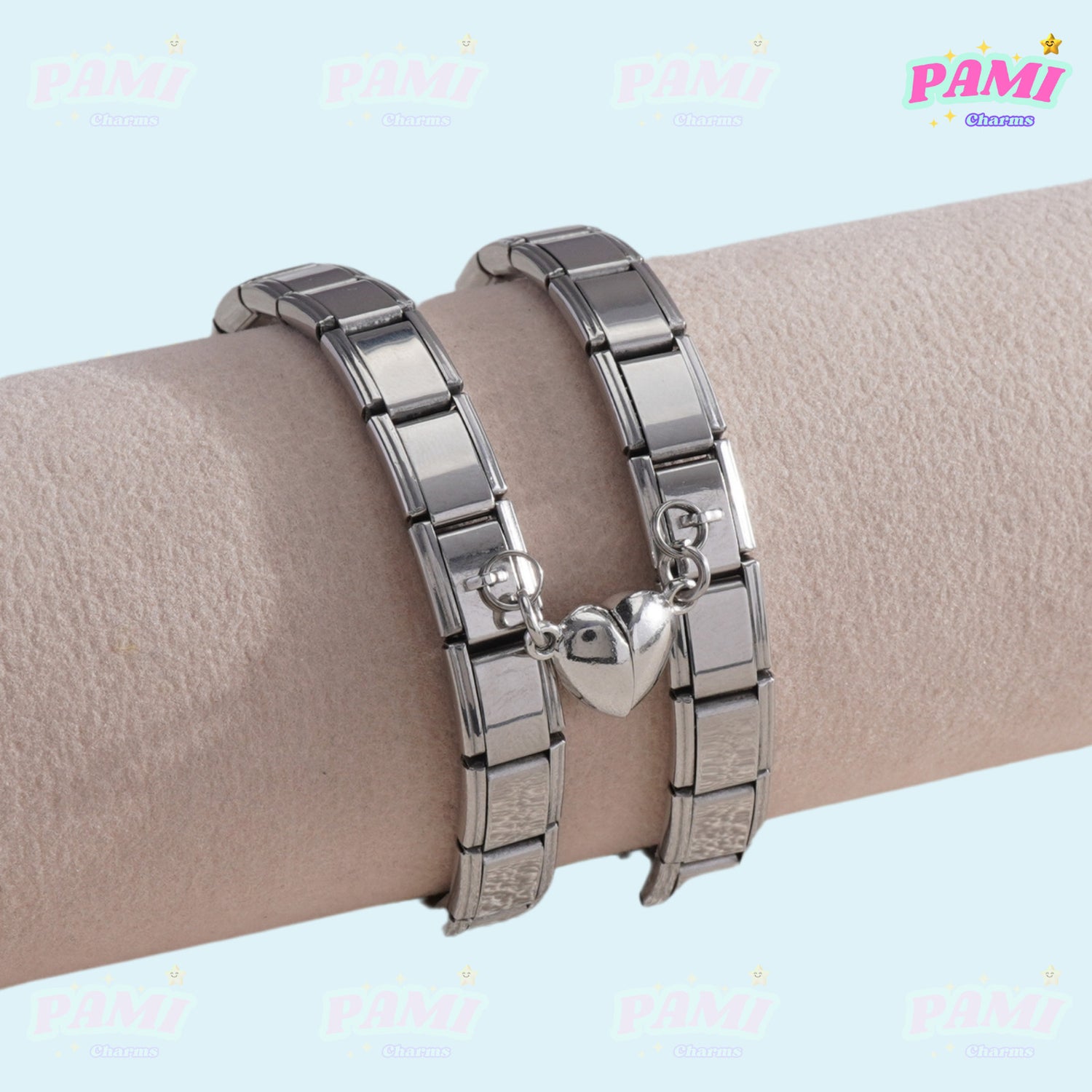 Silver Italian charms bracelet with heart-shaped charm on beige display stand by Pami Charms
