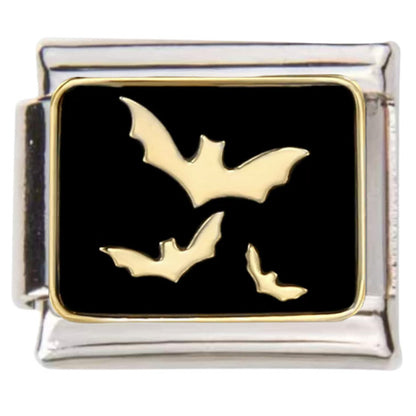 Pami Charms Italian charms featuring three gold bats on a black background in a silver frame